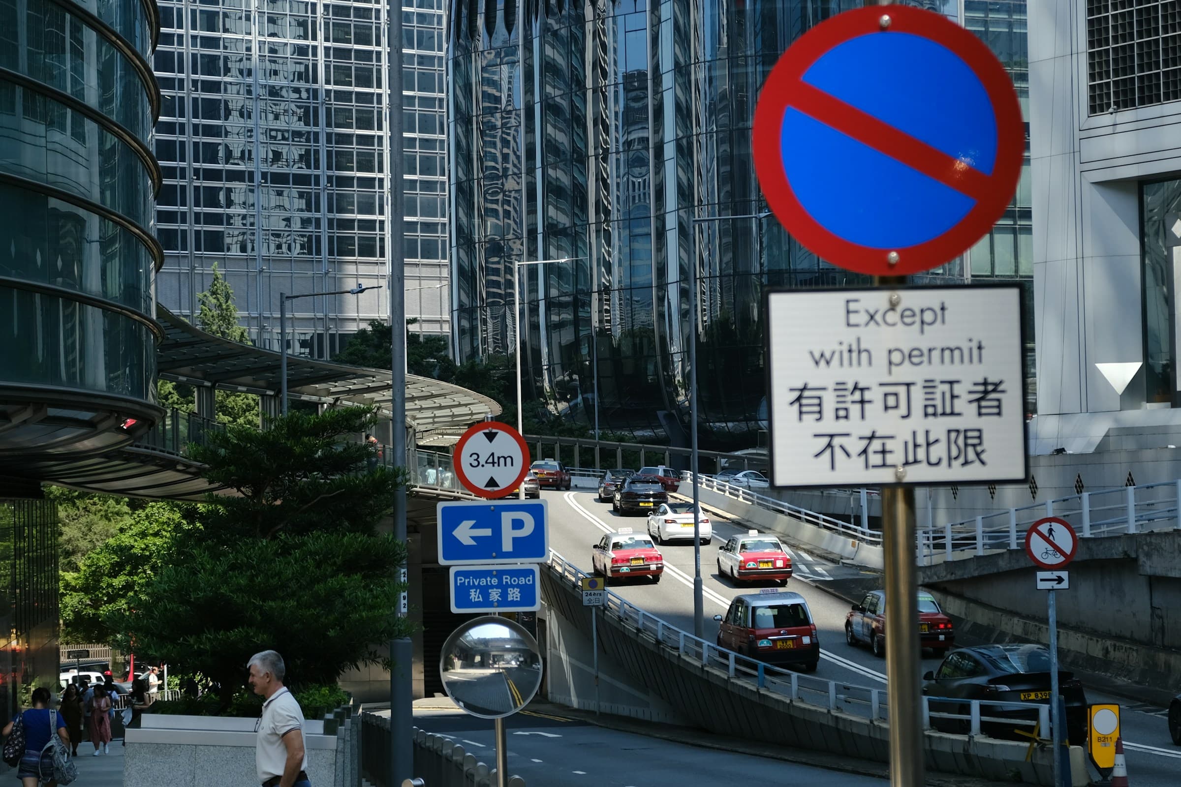Label C vehicle at LPG refueling station with Low Emission Zone sign in background