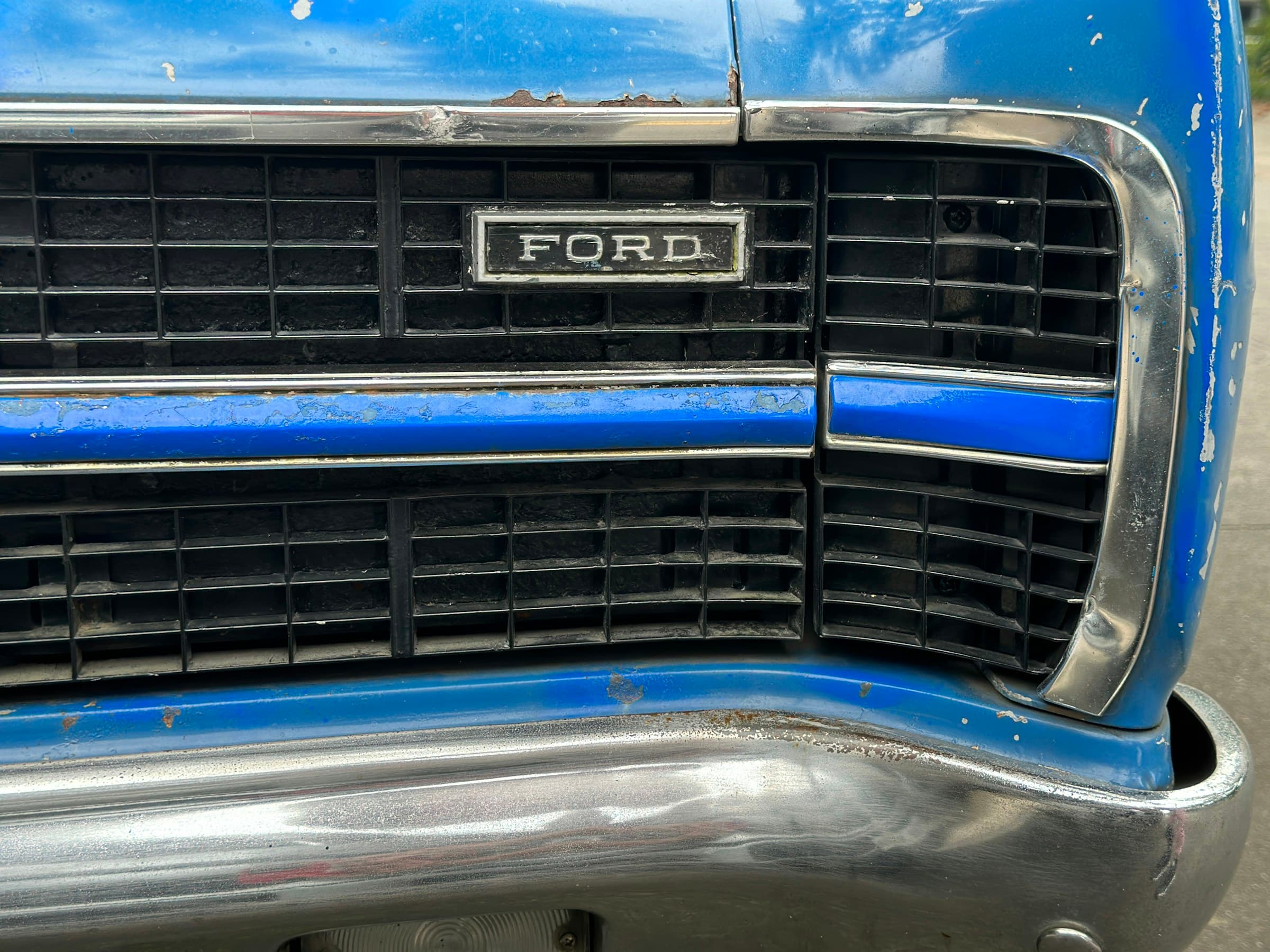 Ford logo on the front grille of an F-150, representing the 2026 recall campaigns affecting millions of vehicles